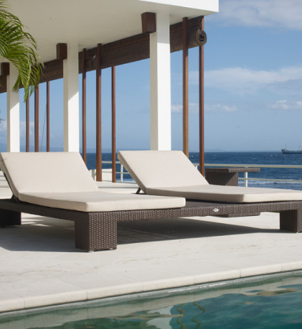 Pool and deck furniture, model ZC-LC6: wicker chaises by an infinity pool
